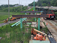 Station 46 bridge construction site with construction equipment during a rainy day.
